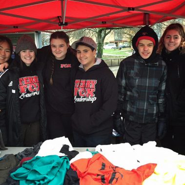 TFF secondary leadership handing out food and clothes